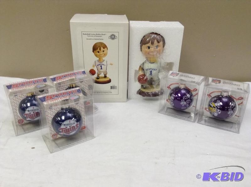 lot 32 image: Vikings and Twins ornaments and University of Kentucky Bobbin Head collectible