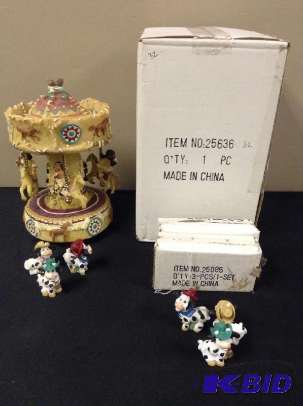 lot 15 image: Carousel and Cow Figurines