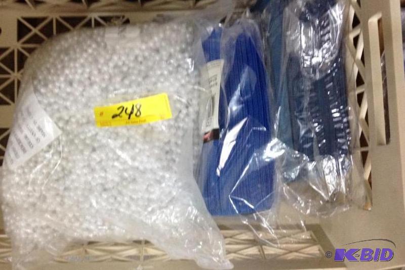 lot 248 image: Full Bag of Plastic Pearl Necklaces and Blue Napkins