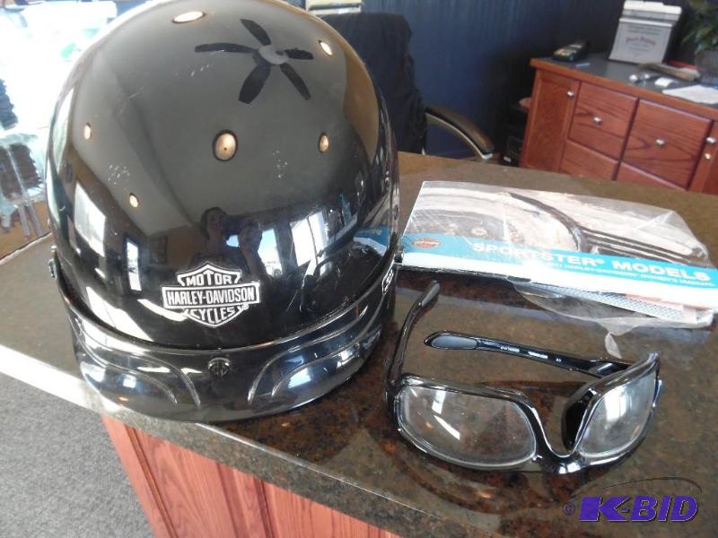 lot 4 image: Harley helmet glasses and owners manual