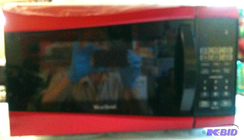 lot 1 image: West Bend Microwave Oven
