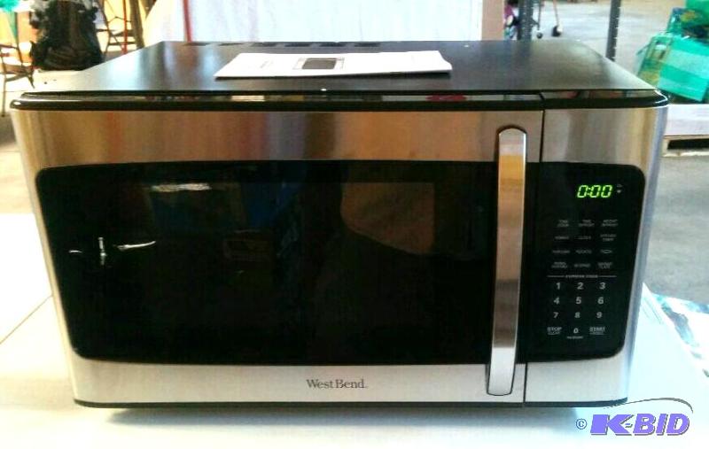 lot 5 image: West Bend Microwave Oven