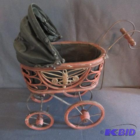 lot 201 image: Wicker Frame Doll Buggy