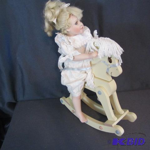 lot 212 image: Amy, Doll On Rocking Horse
