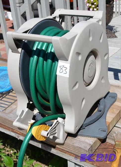 lot 83 image: No-crank retracting garden hose reel...