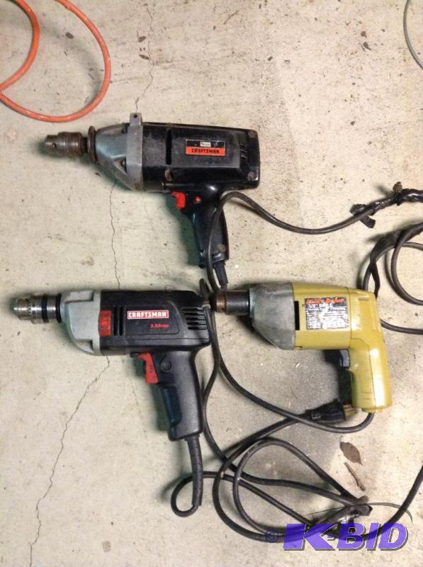 lot 55 image: Three Corded Electric Hand Drills