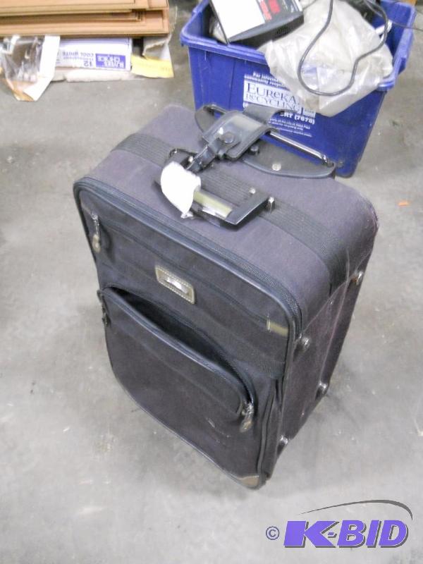 lot 24 image: Rolling Suitcase