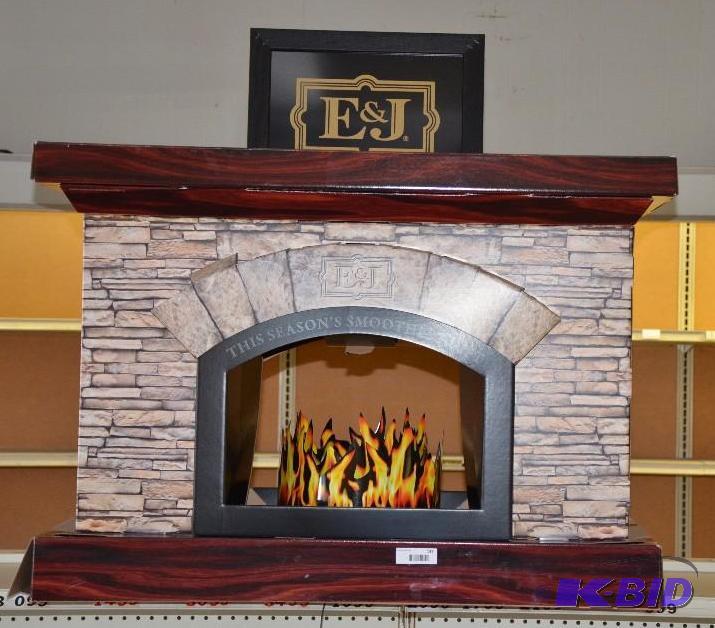 lot 137 image: Advertising Faux Fireplace for E & J Liqu...