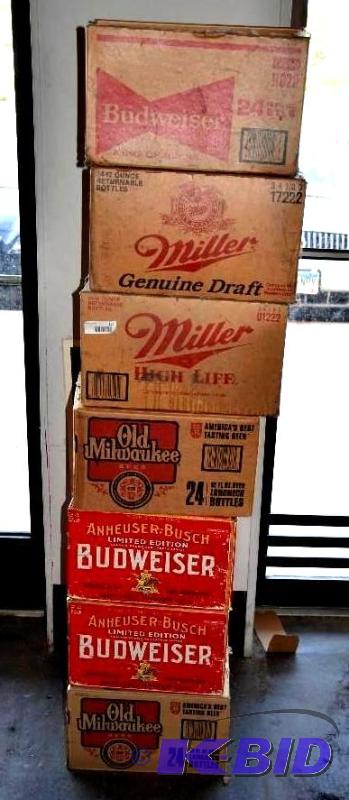 lot 157 image: Stack of 4 boxes of empty beer bottles marked...