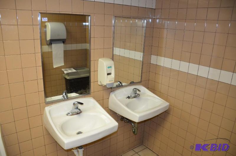 lot 322 image: 2 sinks, counter, hand soap dispenser and mir...