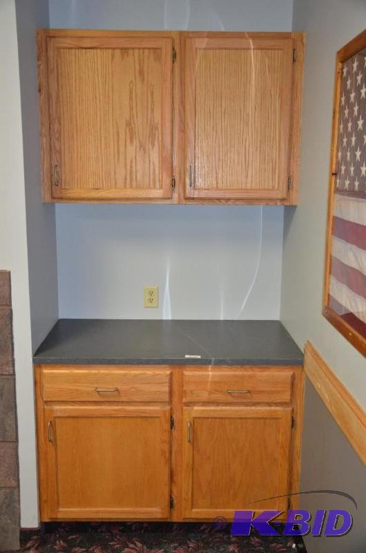 lot 63 image: Upper & lower cabinets in fire place rm. ...