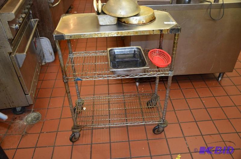 lot 75 image: Rolling Metal Kitchen rack  shelf (needs cle...