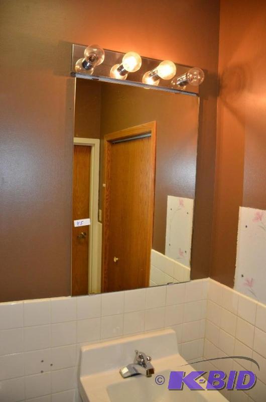 Sink, mirror, and mirror lights. The whole mi...