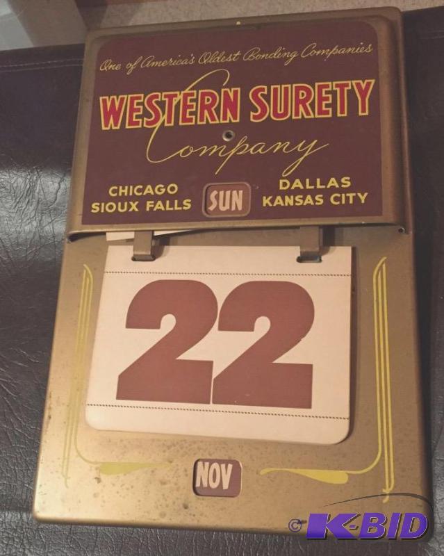 lot 185 image: Vintage Metal Western Surety Lifetime Daily Date Calendar.