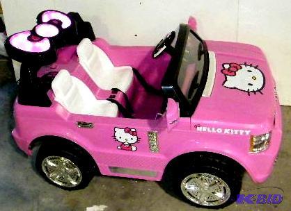 lot 57 image: Hello Kitty Kids Ride On Toy - Has 12V batter...