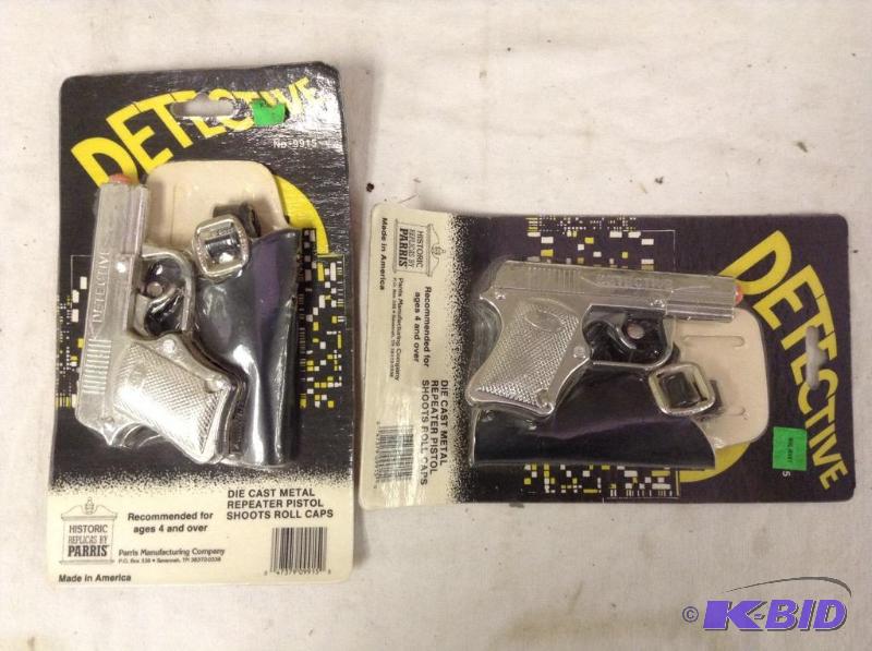 lot 59 image: 2 Toy Detective Die Cast Cap Guns and Holsters