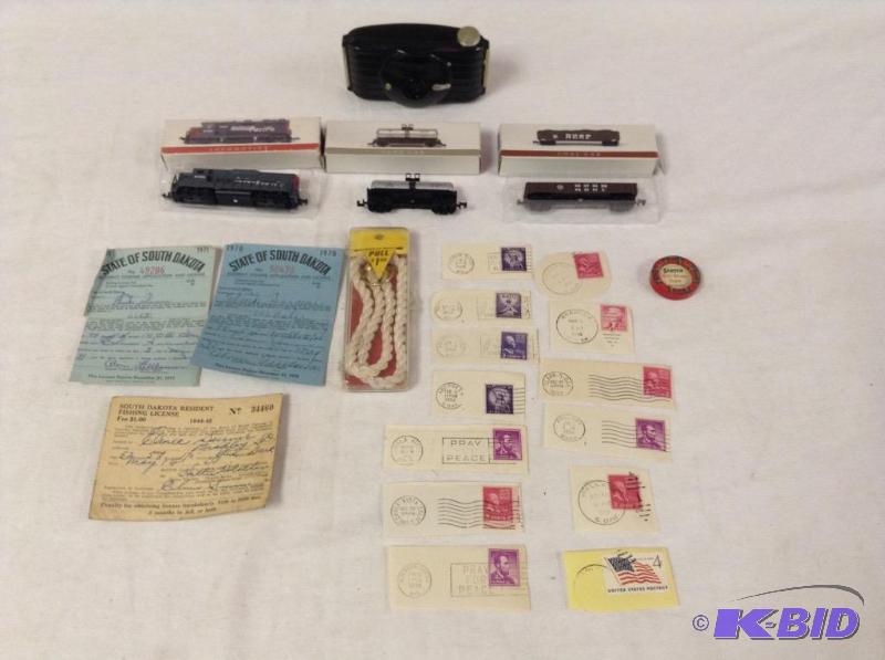 lot 73 image: Lot of vintage items including a Kodak Bullet camera, stamps, and much more