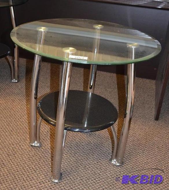 lot 104 image: Glass top round end table. 25&quotx26"...