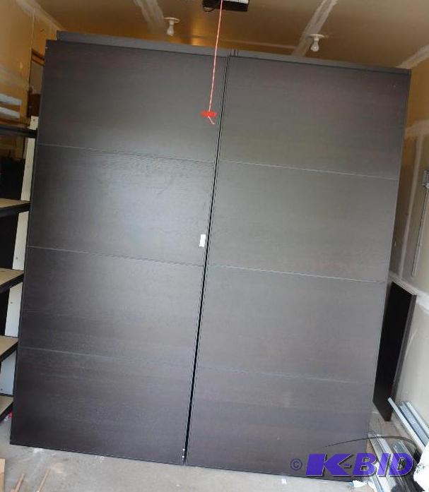 lot 202 image: Pax black-brown wardrobe with sliding doors. ...