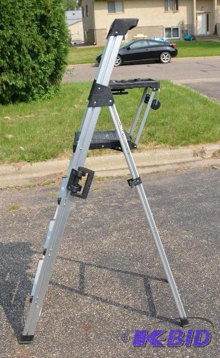 lot 261 image: Cosco 4-step ladder. 69" tall. ...