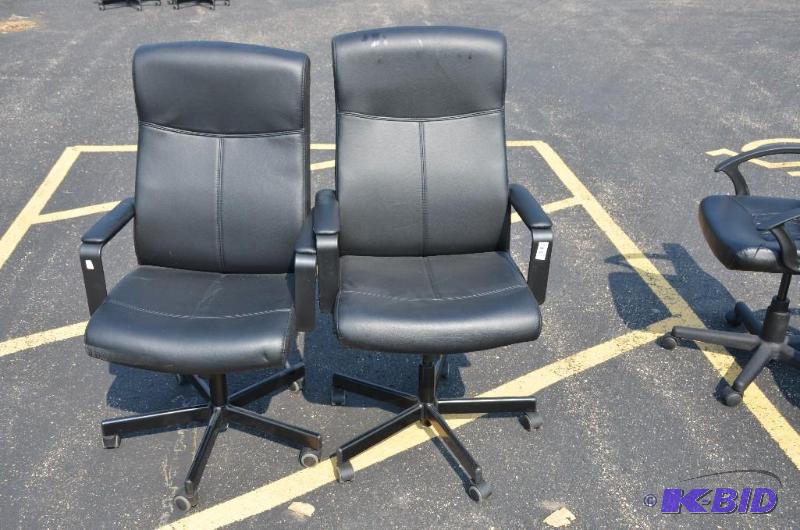 lot 60 image: 2 black leather highback rolling chairs w 100...