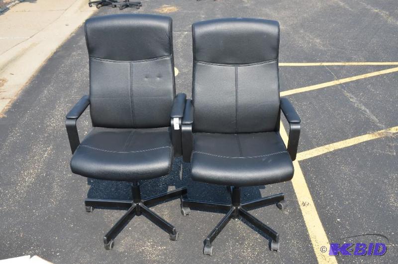 lot 63 image: 2 black leather highback rolling chairs w 100...