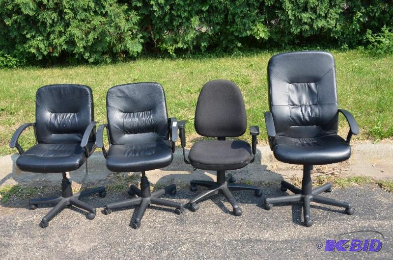 lot 67 image: 4 black rolling chairs, 3 lowback, one highba...