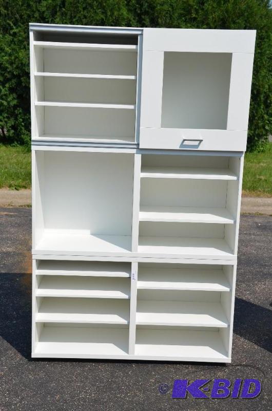 lot 69 image: 3 wood cabinets, one with sliding door 25 14...