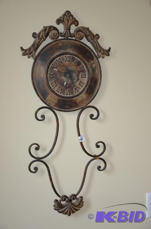 Decorative wall clock made out of metal. Appr...