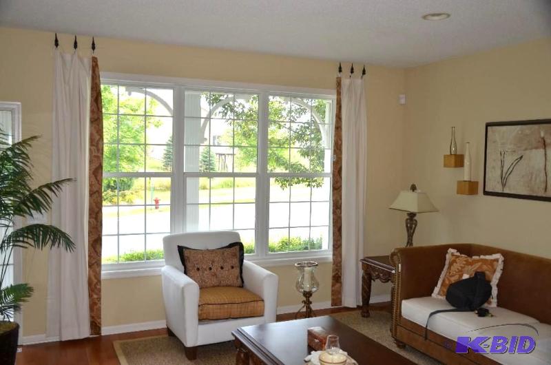 Two sets of window curtains. Each curtain is ...