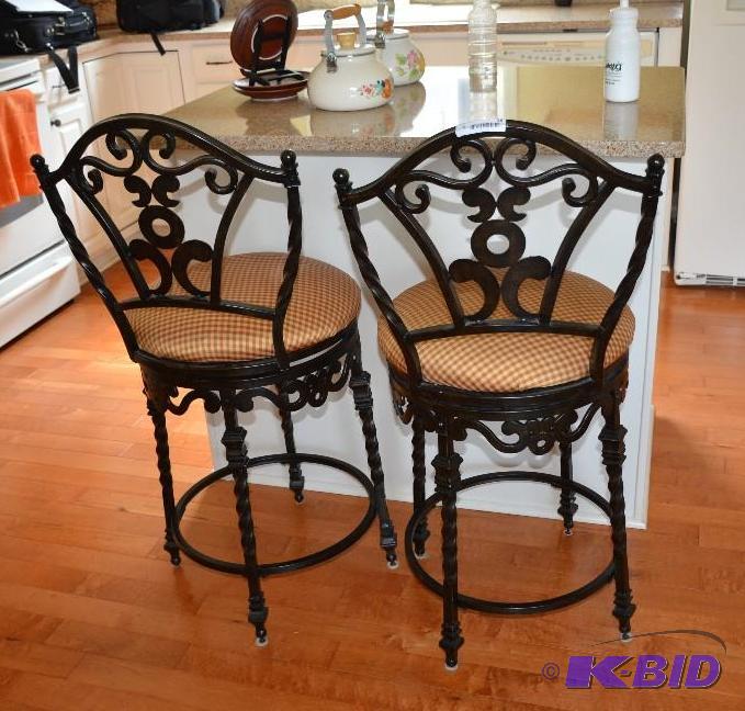 Two metal wrought iron swivel chairs. 41 inch...