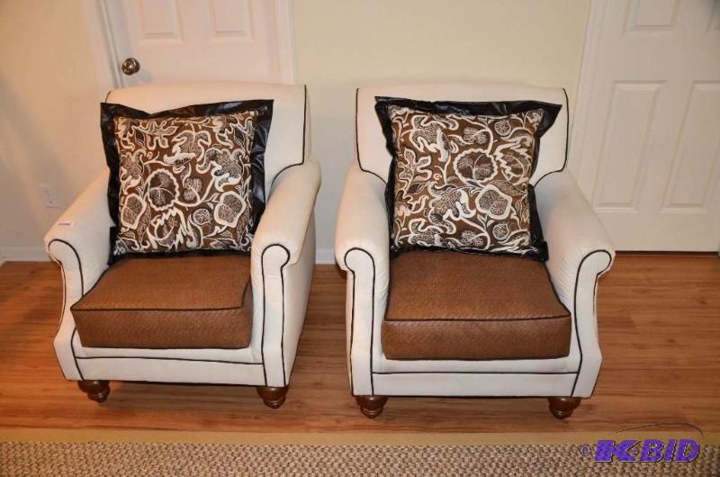 Two matching white chairs with brown woven cu...