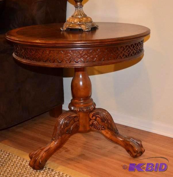 Awesome carved round wood end table with claw...