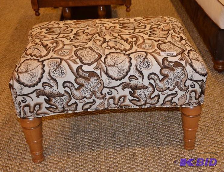Modern design ottoman with wood tapered legs....