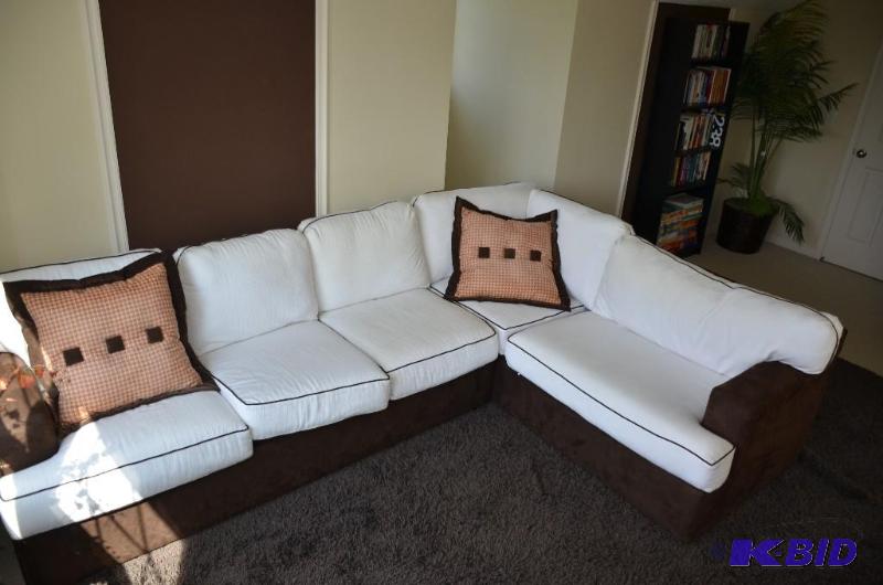 Brown and white L-shaped couch. Nice &amp co...