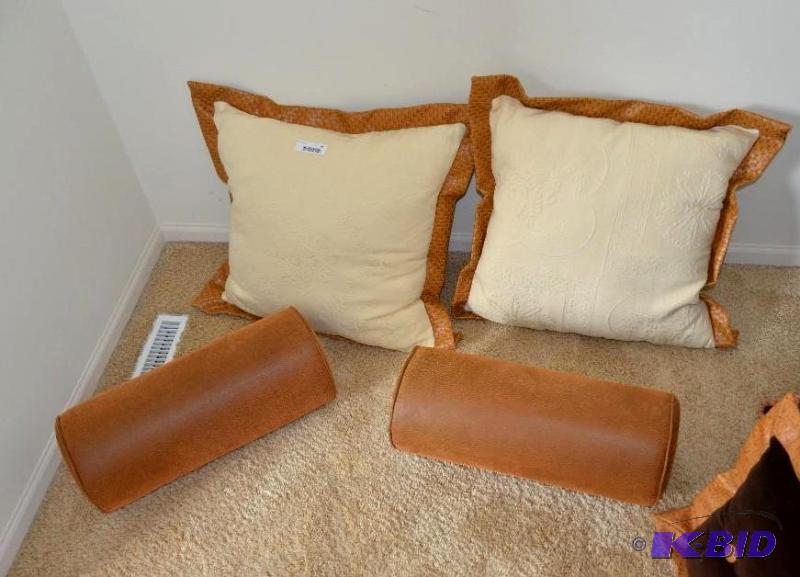 Four accent pillows. The 2 oblong look to be ...