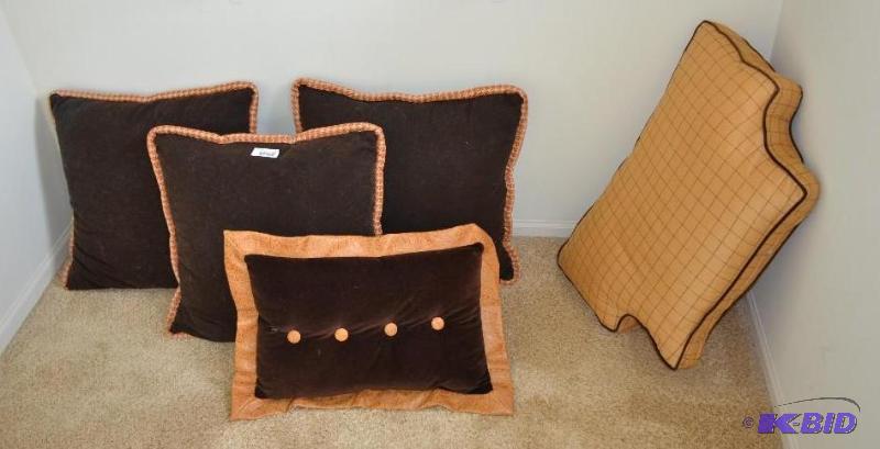 Four accent pillows and one chair cushion....