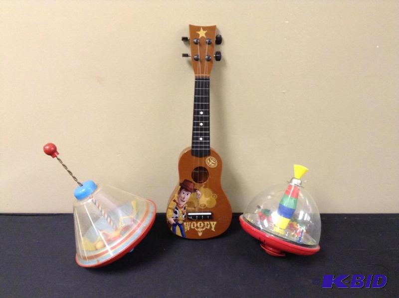 lot 79 image: Vintage Toy Tops & Woody Guitar