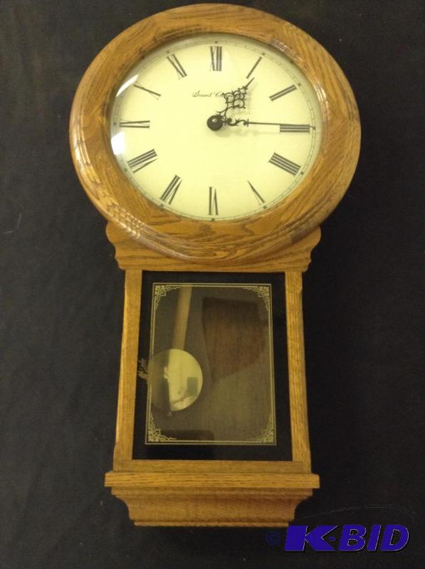 lot 11 image: Wooden Saint Charles Wall Clock