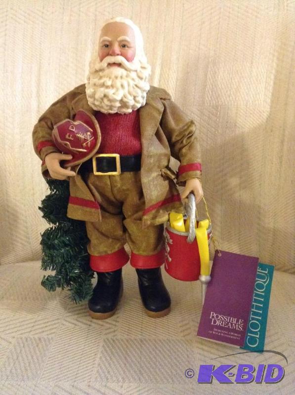 lot 100 image: Collectible Clothtique Firefighter Santa