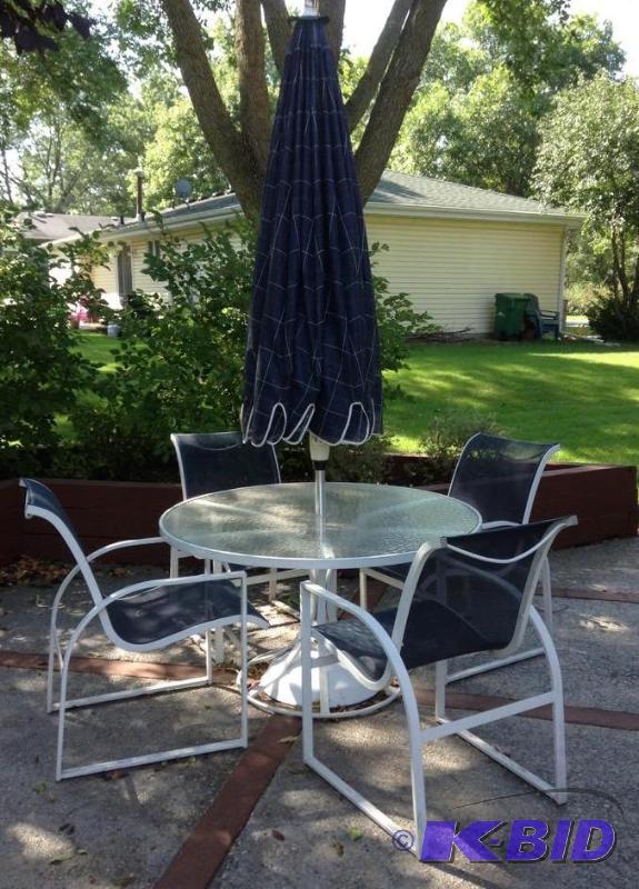lot 93 image: Patio Dining Set with Four Chairs and Umbrella