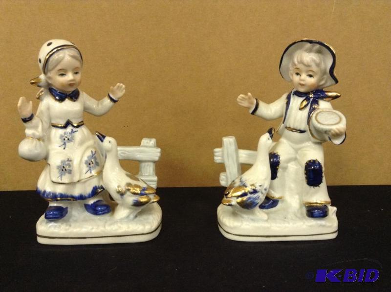 lot 27 image: Boy & Girl Goose Figurines
