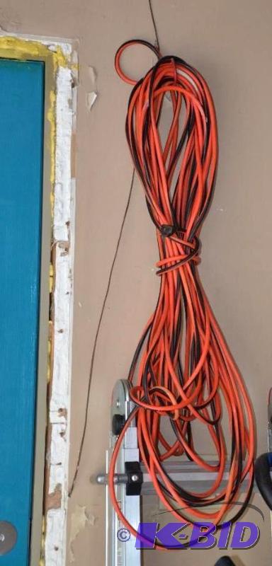 lot 219 image: Long Orange & Black extension chord...