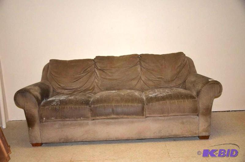 lot 24 image: Feels like a suede couch aprox 80" long ...