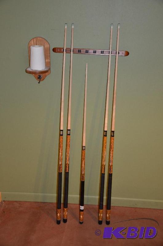 lot 27 image: 5 pool sticks. wall chalk. and mounting bar...