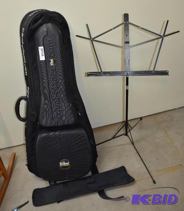 lot 31 image: Tribal Planet guitar case & 1 music stand...