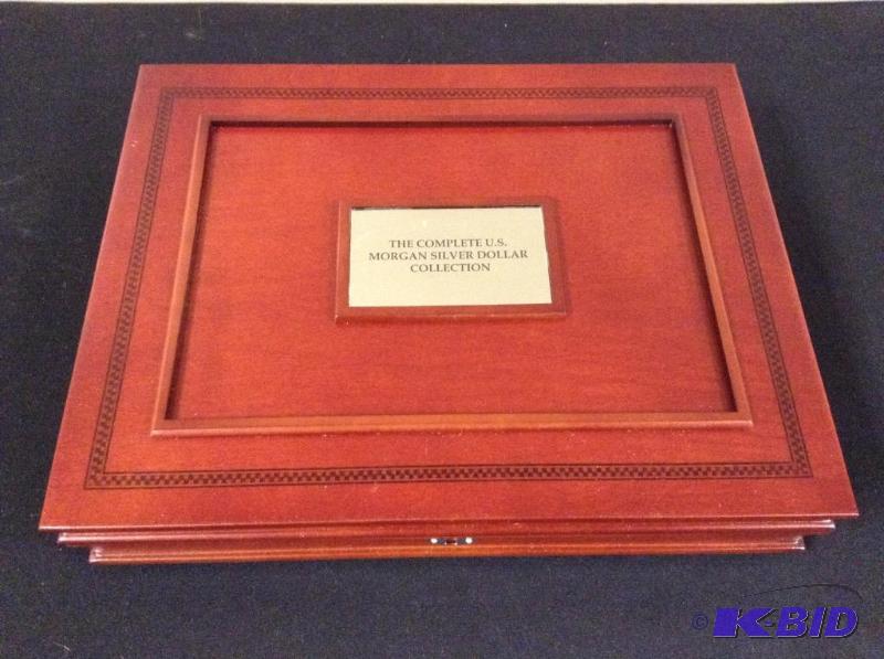 lot 18 image: Morgan Silver Dollar Wood Case