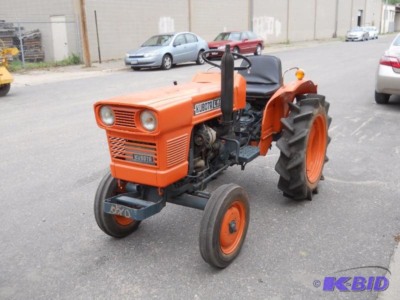 lot 4 image: Kubota L1501 Tractor. Starts, Runs, Drives. New Tires and Paint.
