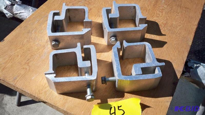 SET OF 4 ALUMINUM TOPPER CLAMPS...