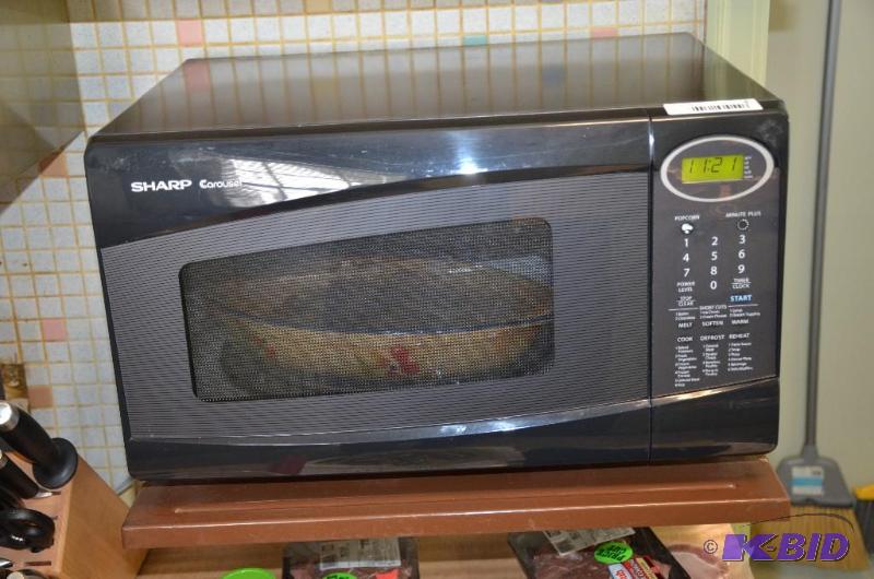 lot 5 image: Sharp microwave model R308N, powers up...